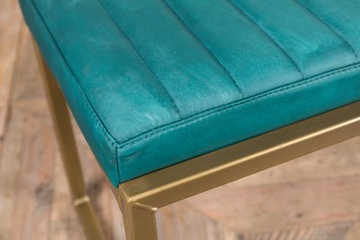 blue faux leather and brass frame bench